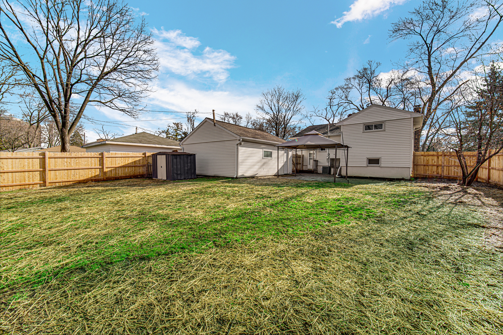 2109 Robin Lane Rolling Meadows, IL 60008 - Photo 5 of 21 a view of a house with a big yard