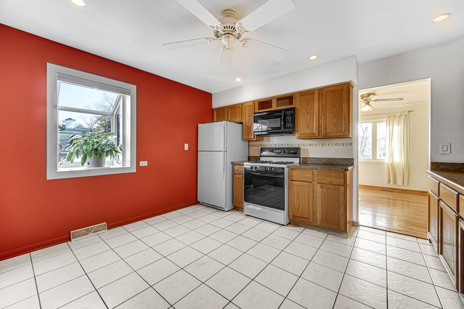 2109 Robin Lane Rolling Meadows, IL 60008 - Photo 10 of 21 a kitchen with stainless steel appliances cabinets a sink and a stove top oven