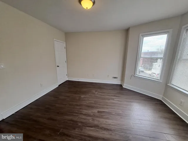 a white toilet sitting next to a bathroom sink and tub