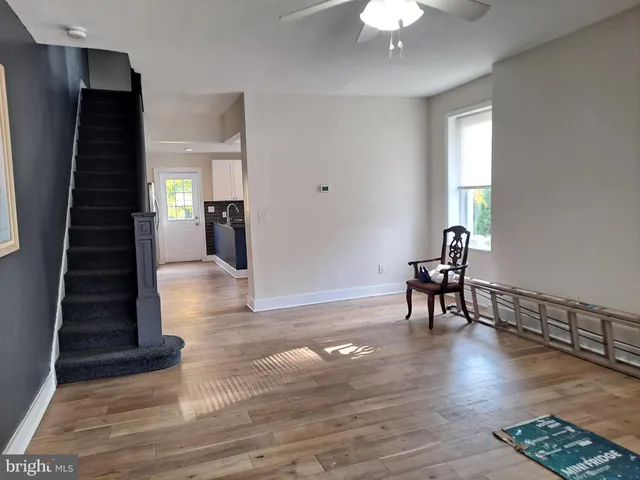 a kitchen with granite countertop a stove and a microwave