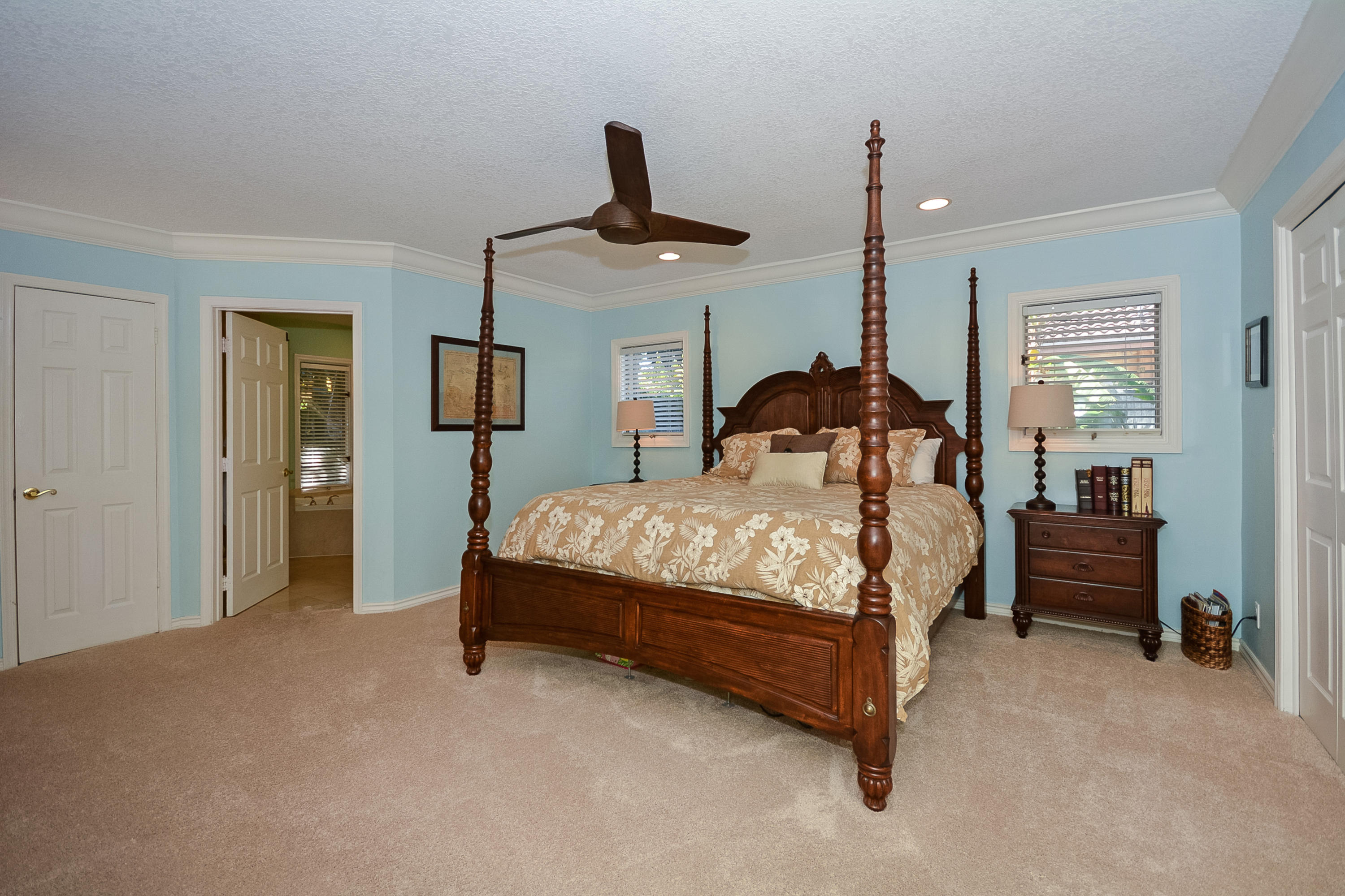 856 Appleby Street Boca Raton, FL 33487 - Photo 15 of 30 a bedroom with a bed and a chandelier