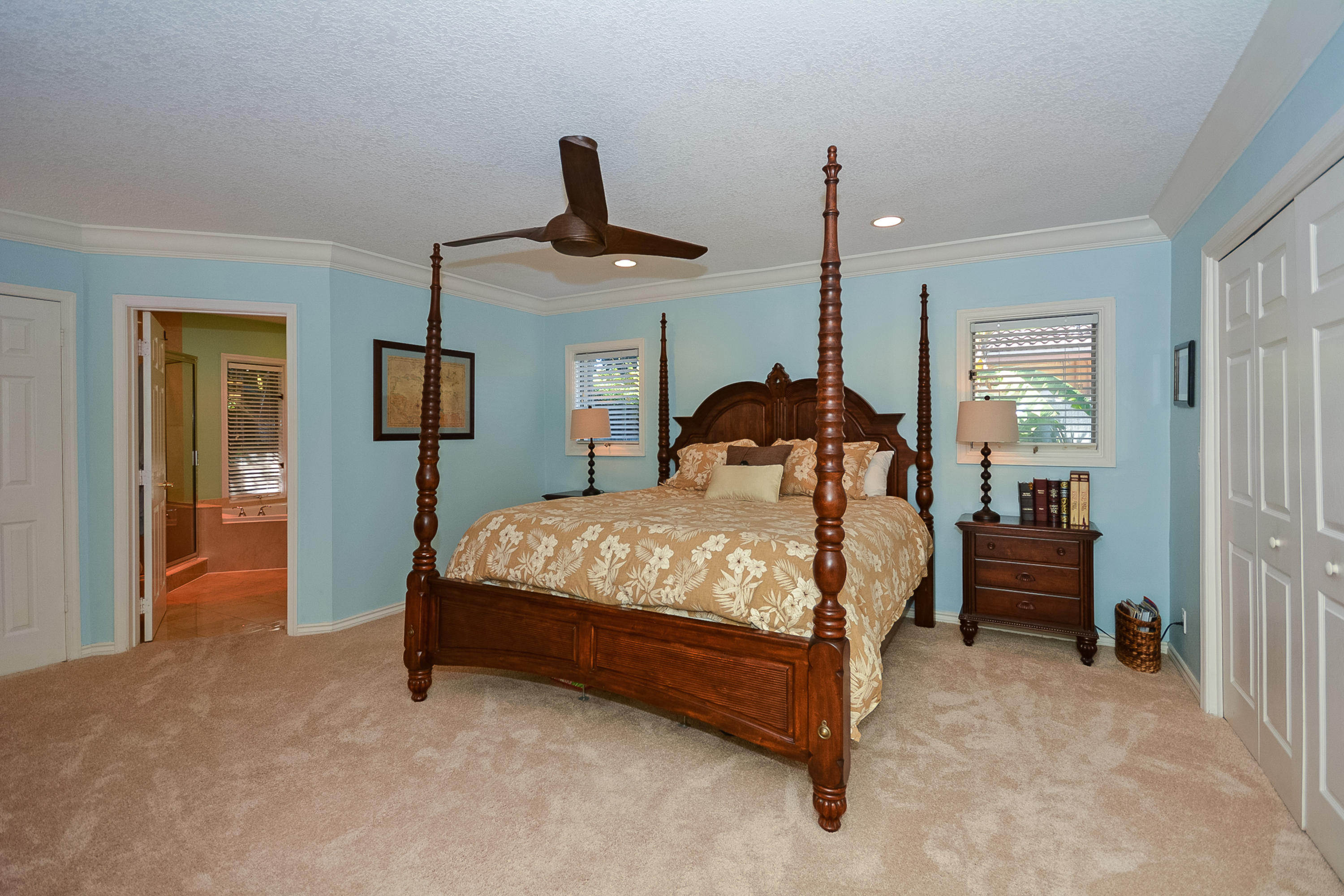856 Appleby Street Boca Raton, FL 33487 - Photo 16 of 30 a bedroom with a bed and a chandelier