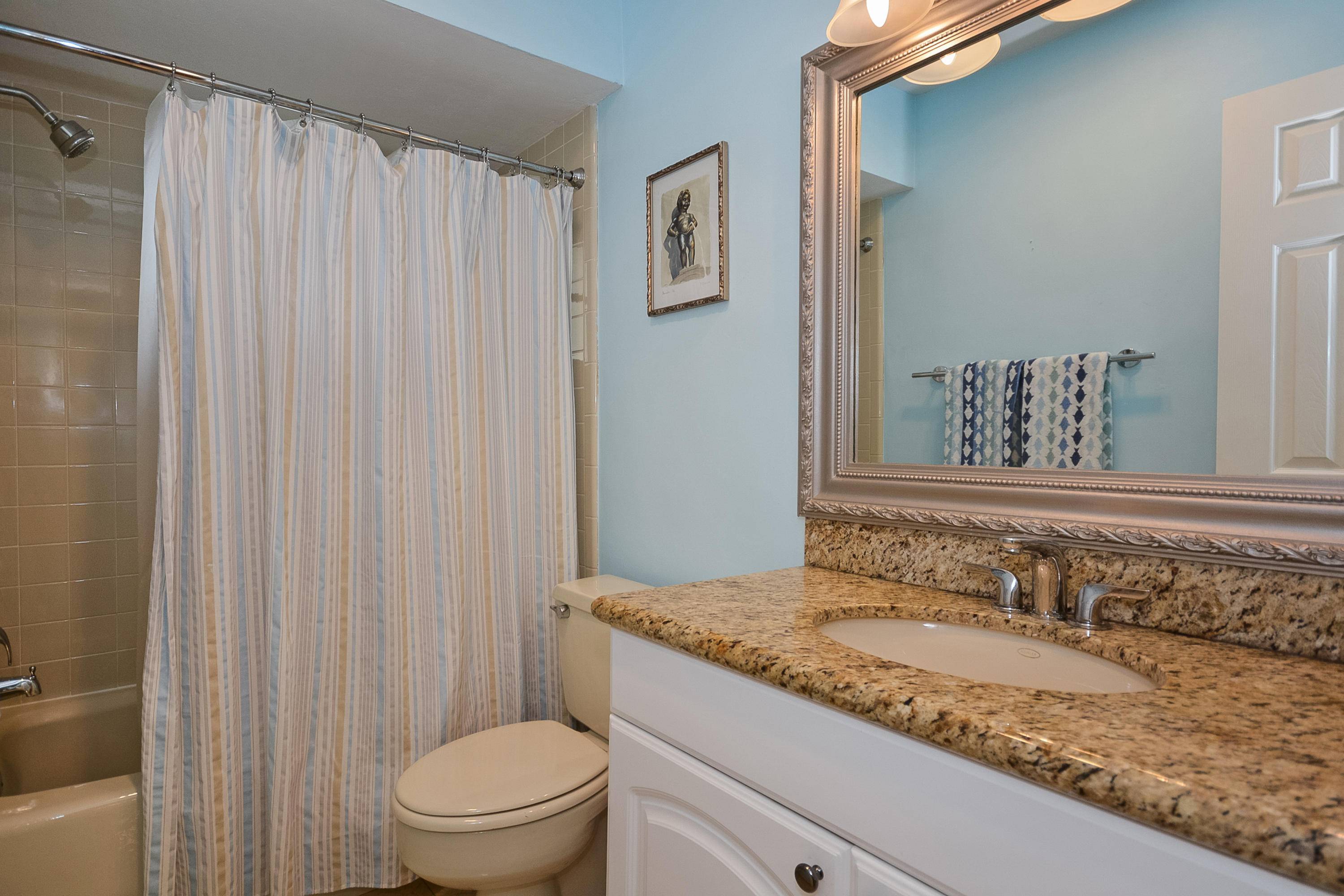 856 Appleby Street Boca Raton, FL 33487 - Photo 22 of 30 a bathroom with a granite countertop sink and a mirror