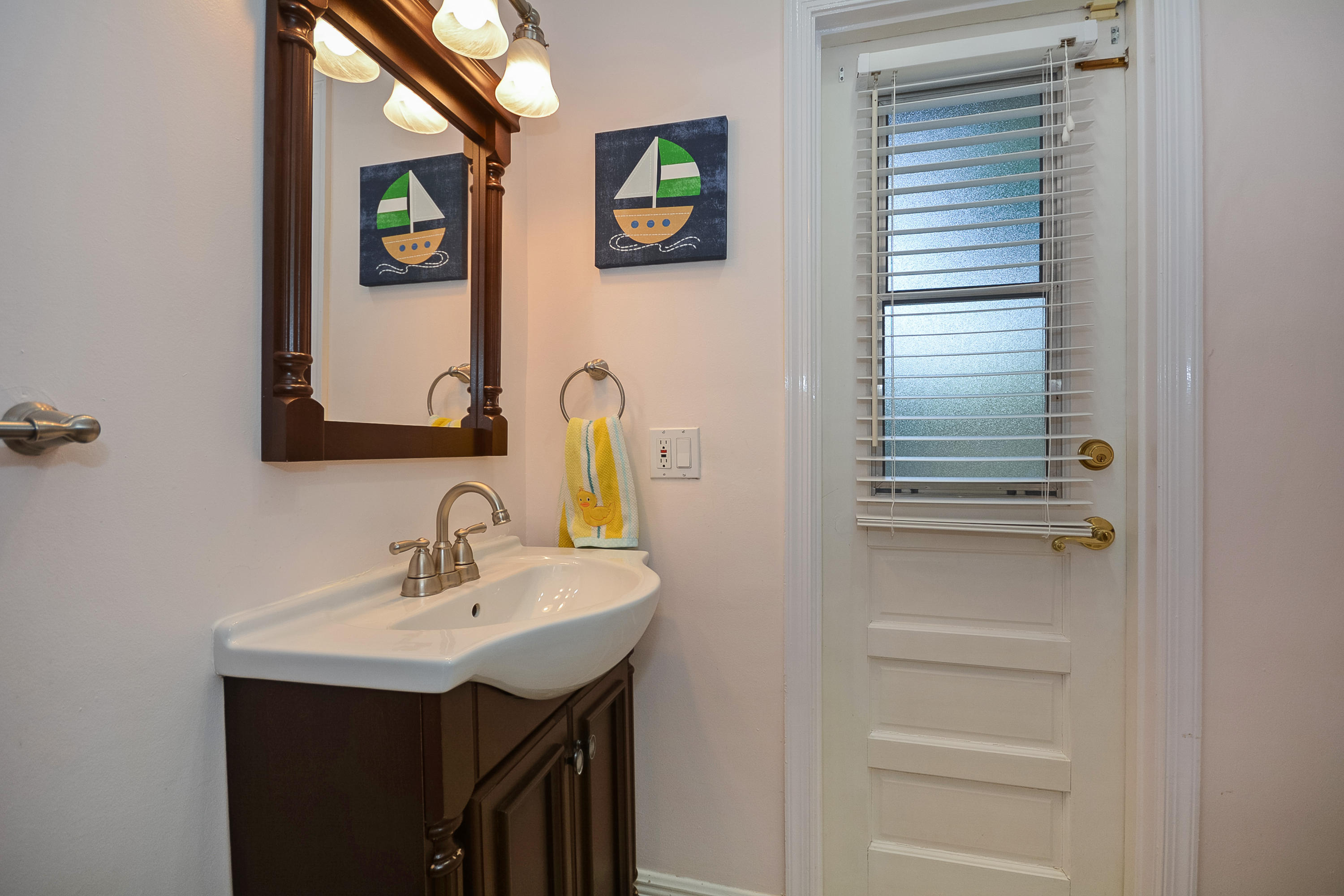 856 Appleby Street Boca Raton, FL 33487 - Photo 24 of 30 a bathroom with a sink and a mirror