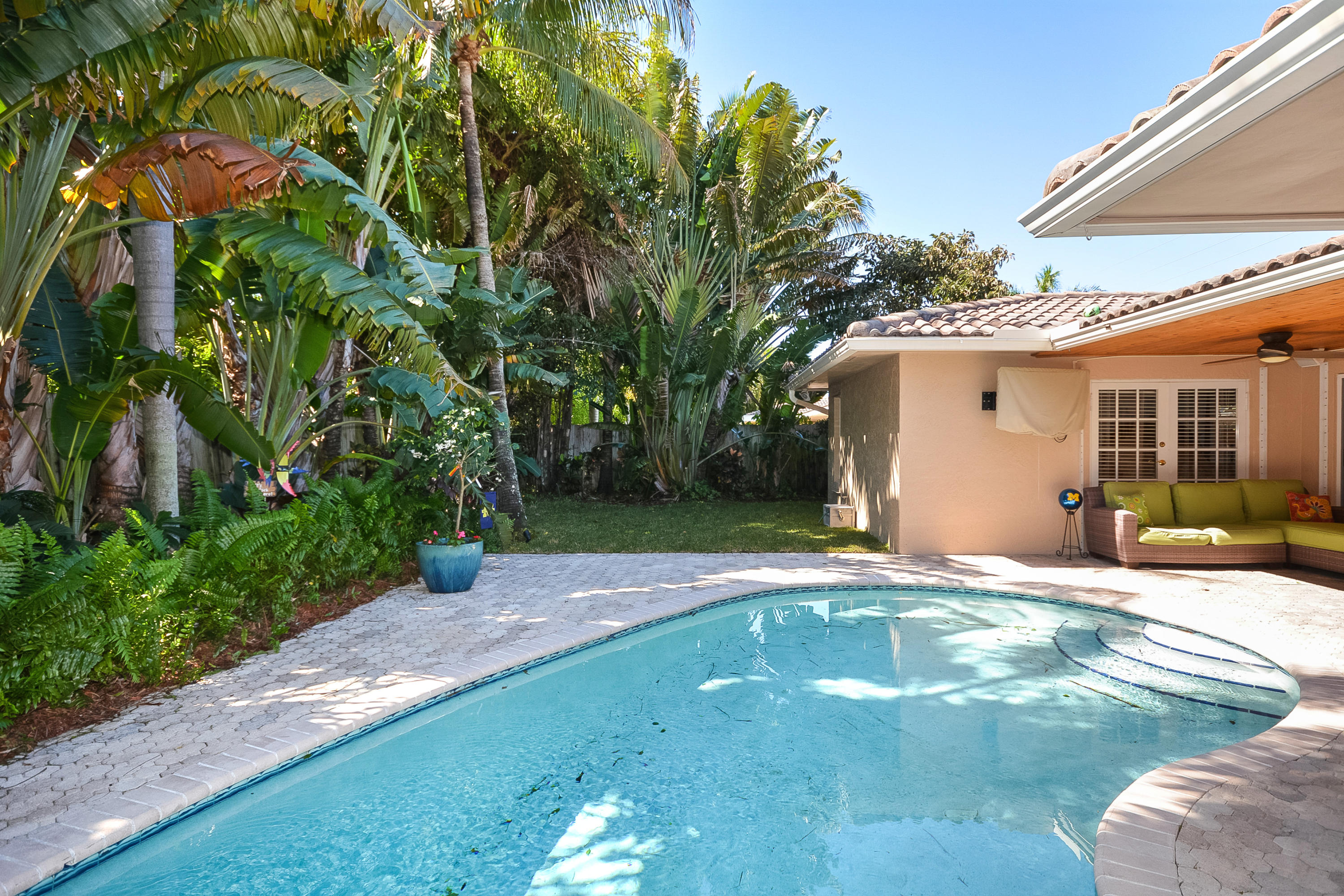 856 Appleby Street Boca Raton, FL 33487 - Photo 27 of 30 a view of a white house with a yard