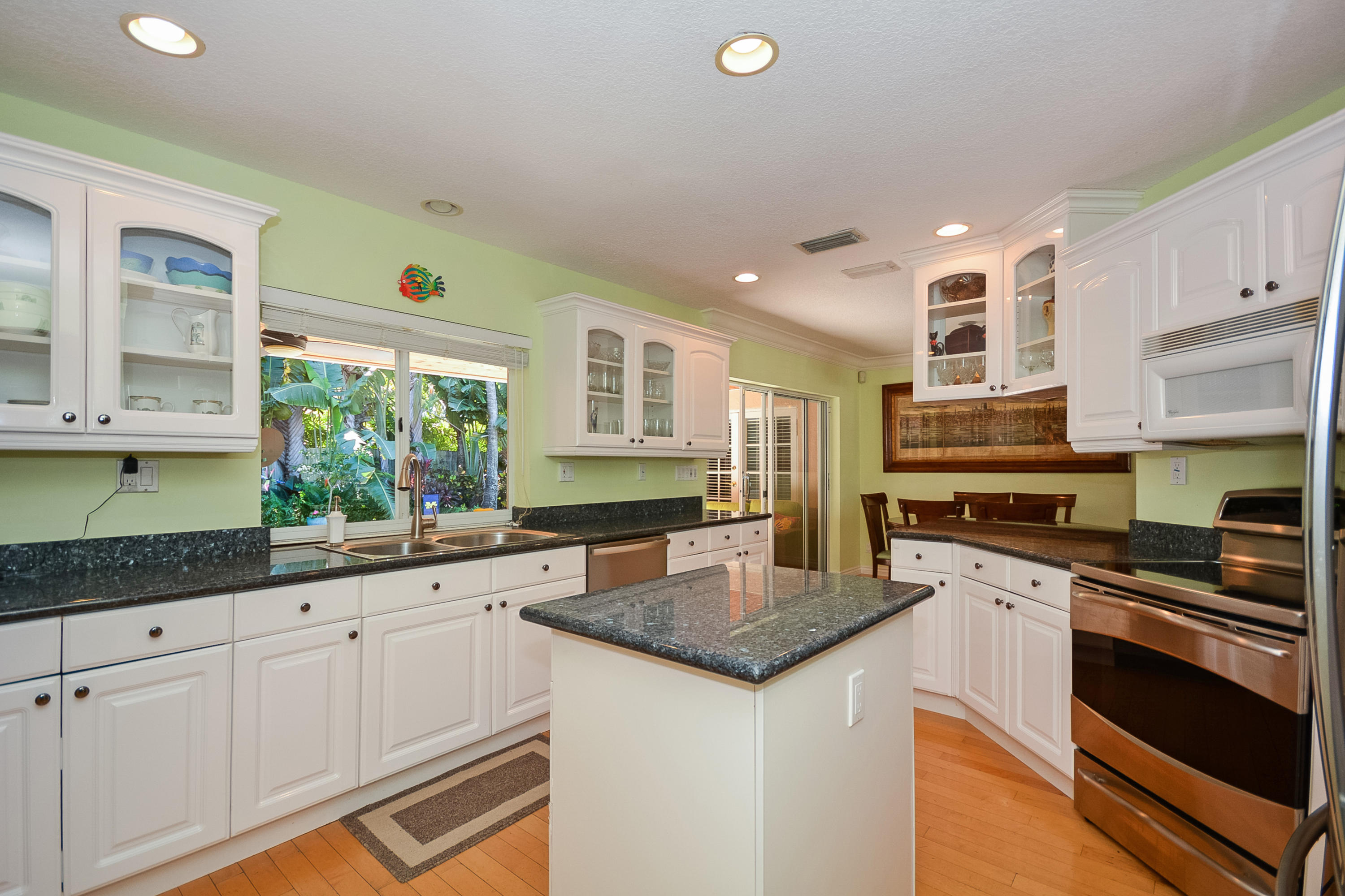 856 Appleby Street Boca Raton, FL 33487 - Photo 6 of 30 a kitchen with granite countertop a sink cabinets and stainless steel appliances
