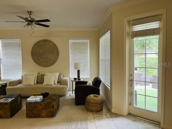 a living room with furniture and a window