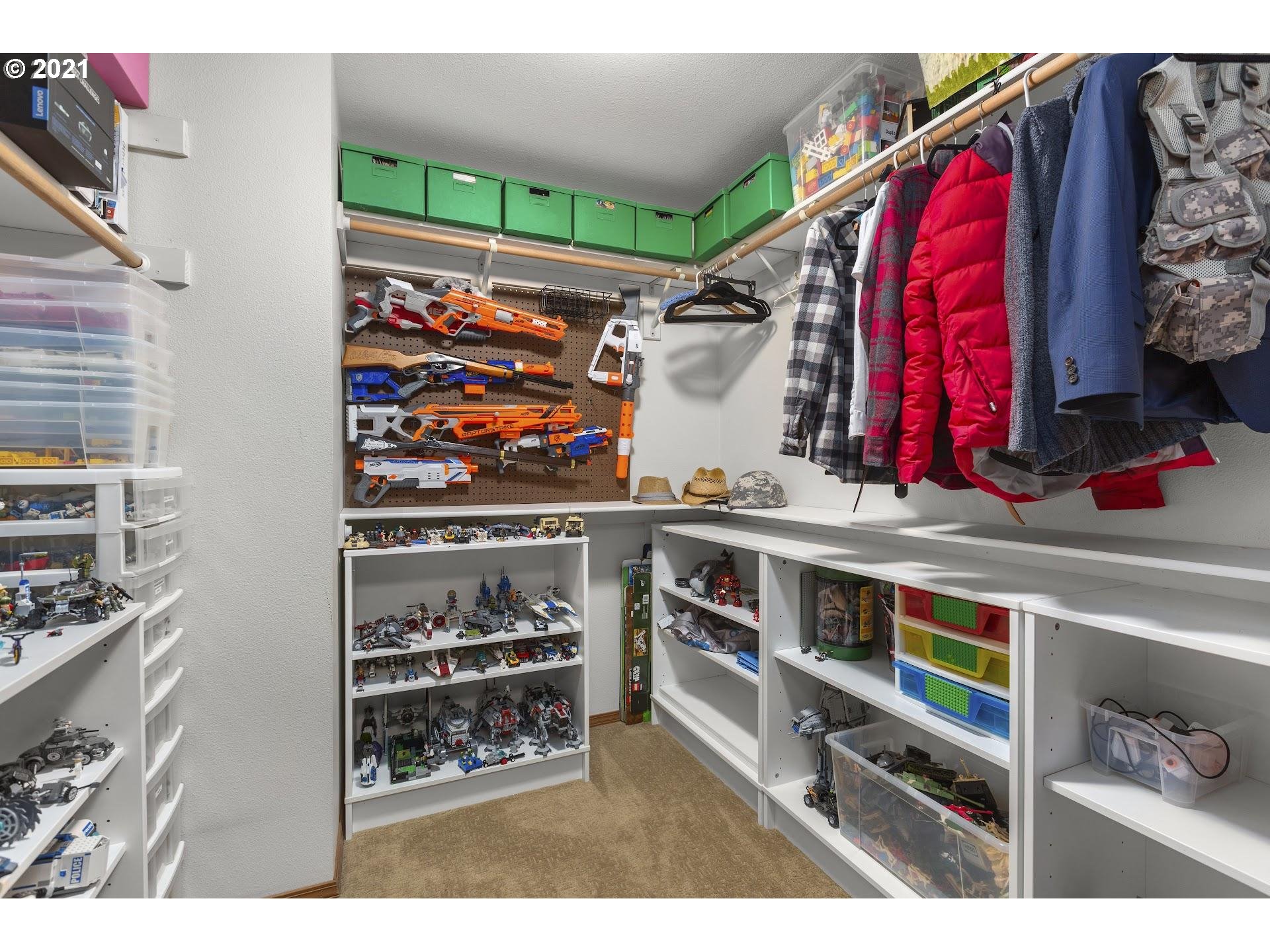 22382 South Penman Road Oregon City, OR 97045 - Photo 14 of 31 a view of walk in closet with clothes and shoes
