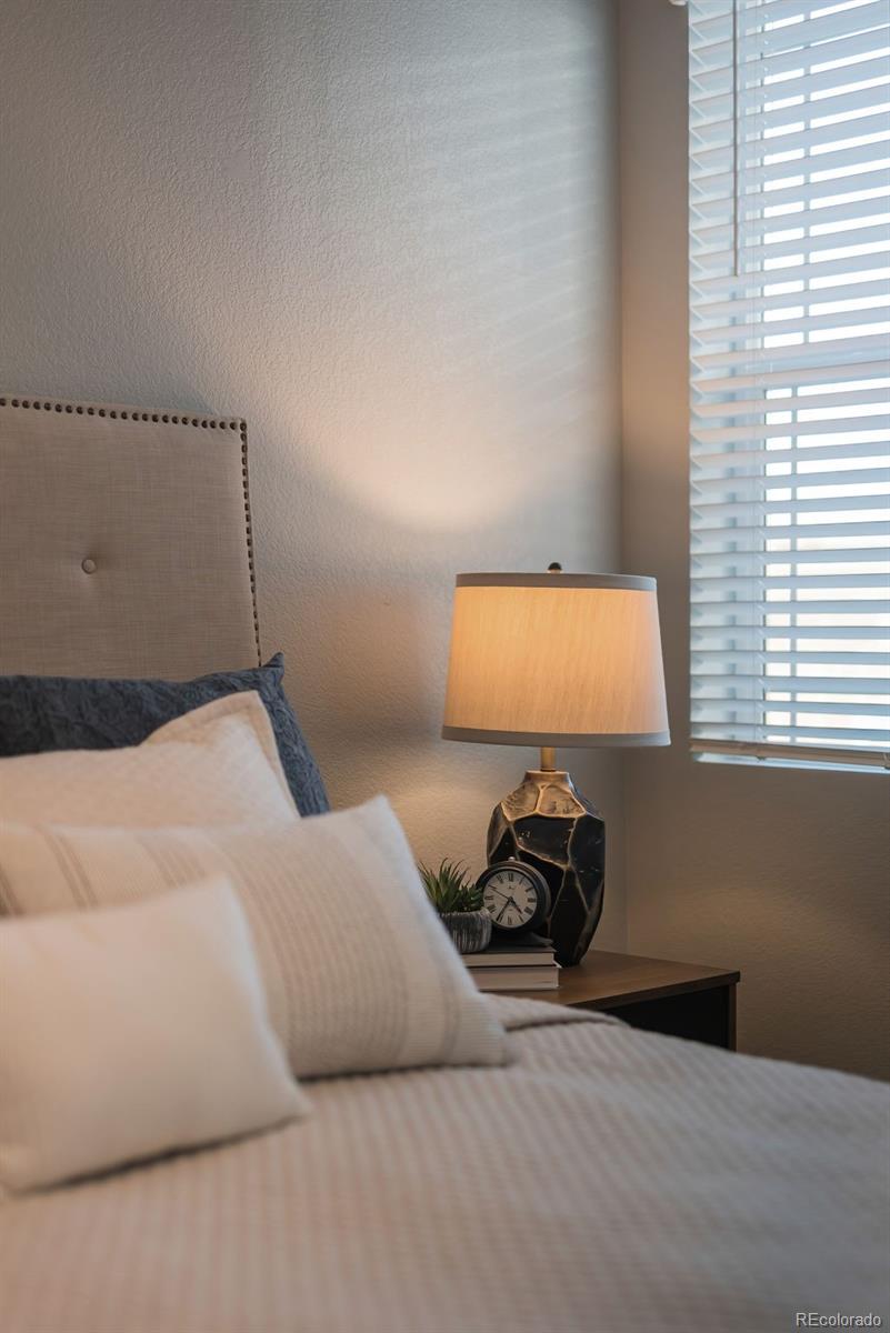 22603 East Radcliff Drive Aurora, CO 80015 - Photo 18 of 42 a bedroom with a bed and a window