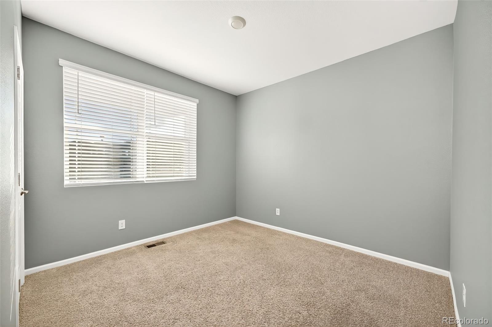 22603 East Radcliff Drive Aurora, CO 80015 - Photo 24 of 42 a view of an empty room with a window