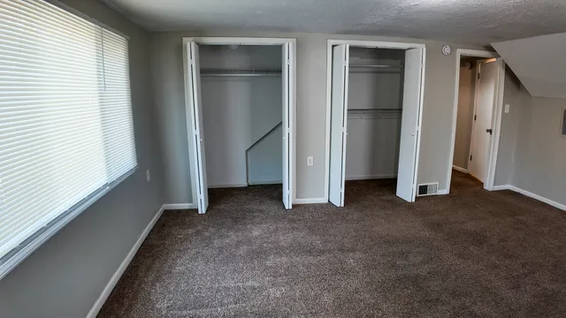 a view of empty room with closet