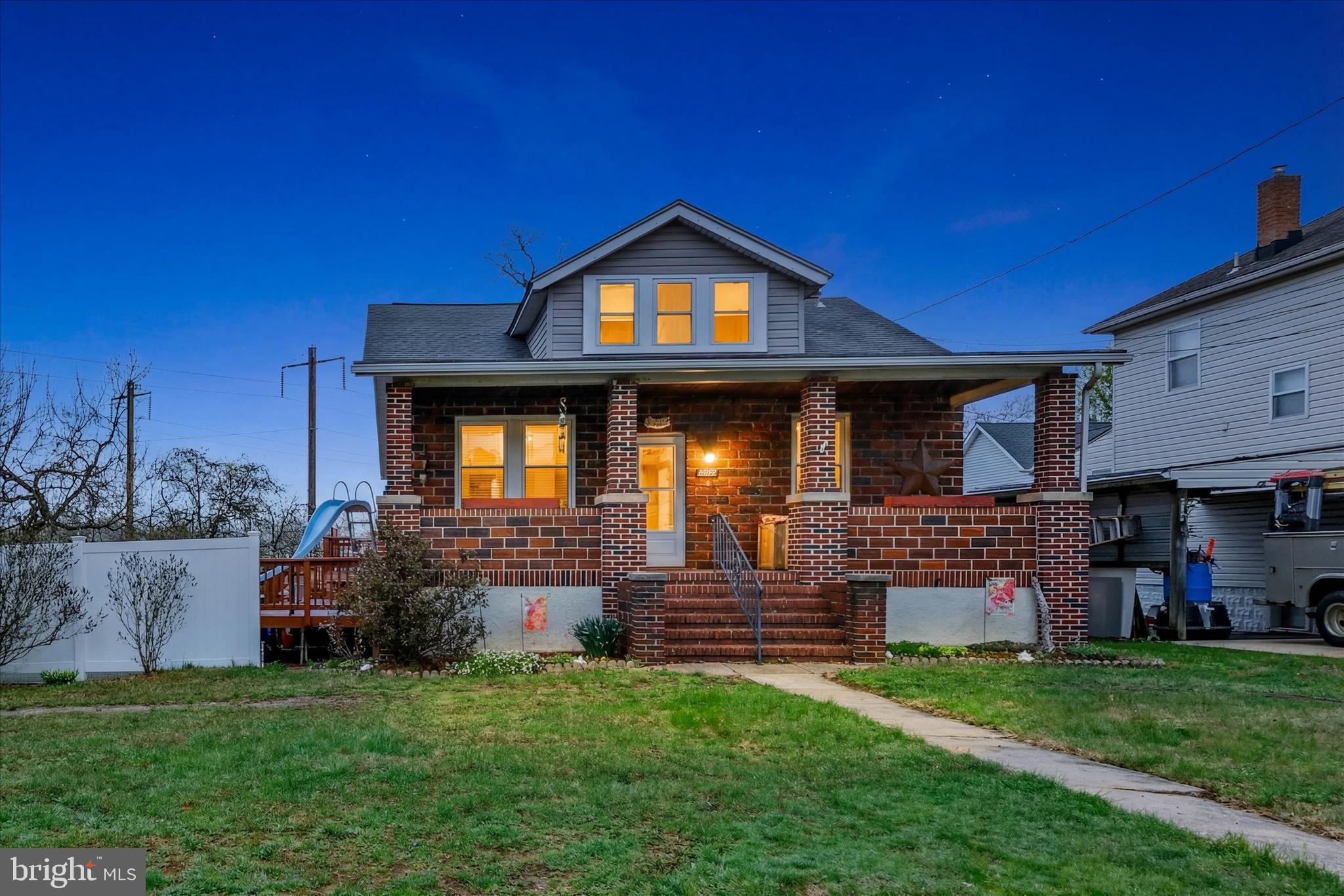 4630 Magnolia Avenue Baltimore, MD 21227 - Photo 2 of 31 a front view of a house with garden