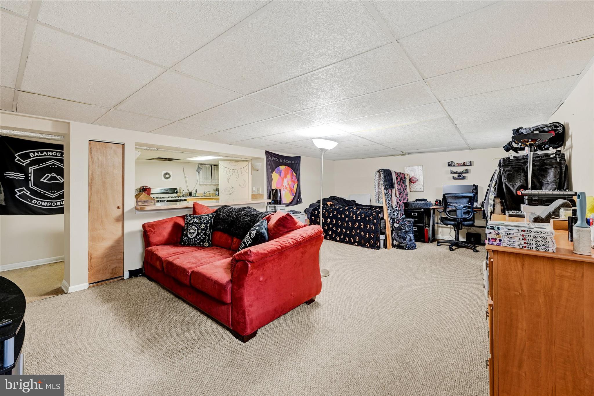 4630 Magnolia Avenue Baltimore, MD 21227 - Photo 23 of 31 a living room with furniture and a flat screen tv