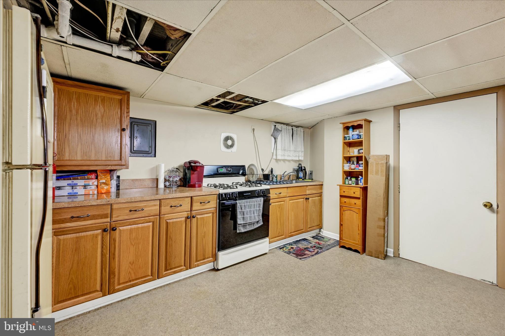 4630 Magnolia Avenue Baltimore, MD 21227 - Photo 24 of 31 a kitchen with sink cabinets and window
