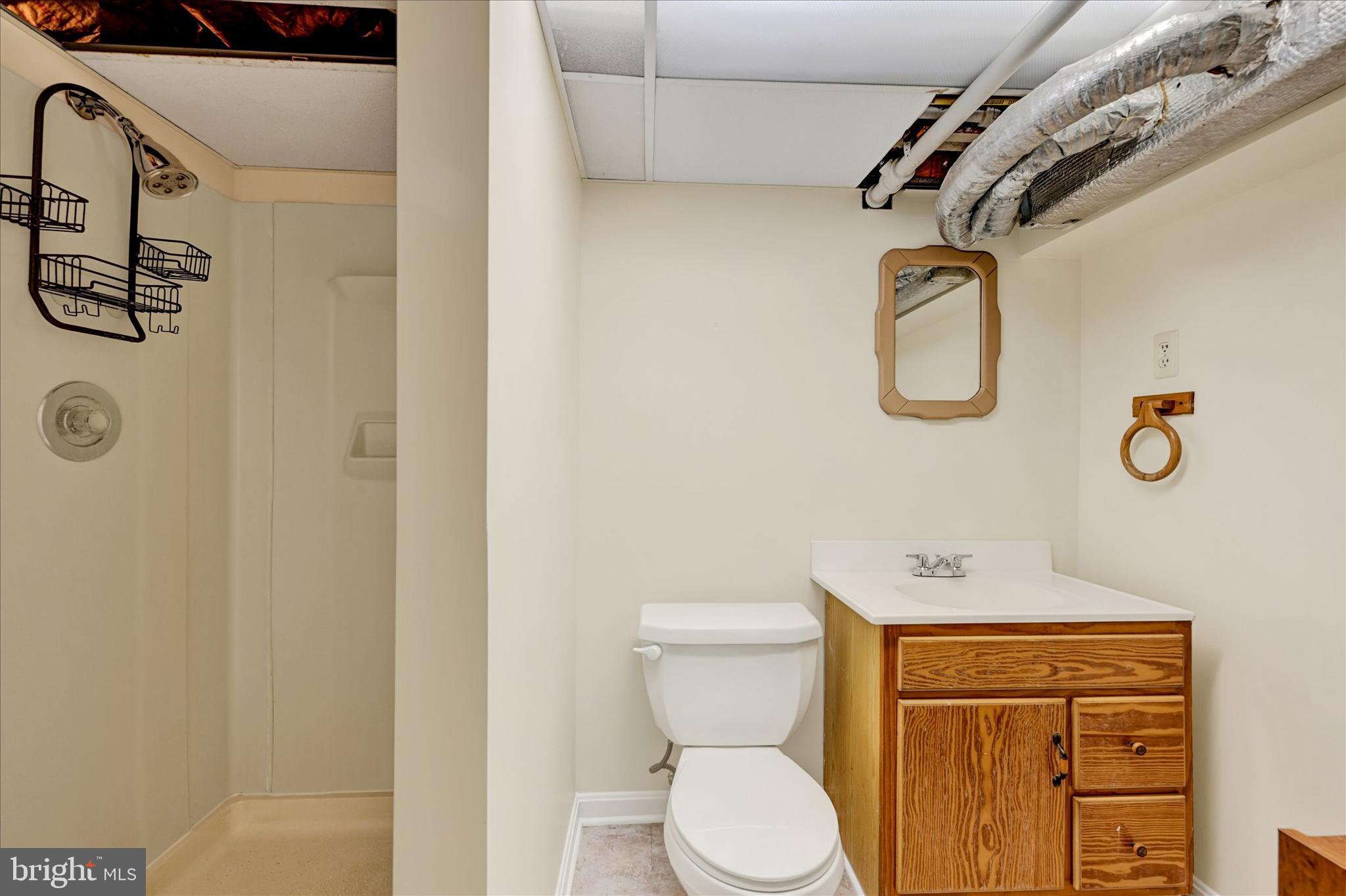4630 Magnolia Avenue Baltimore, MD 21227 - Photo 26 of 31 a bathroom with a toilet sink and shower