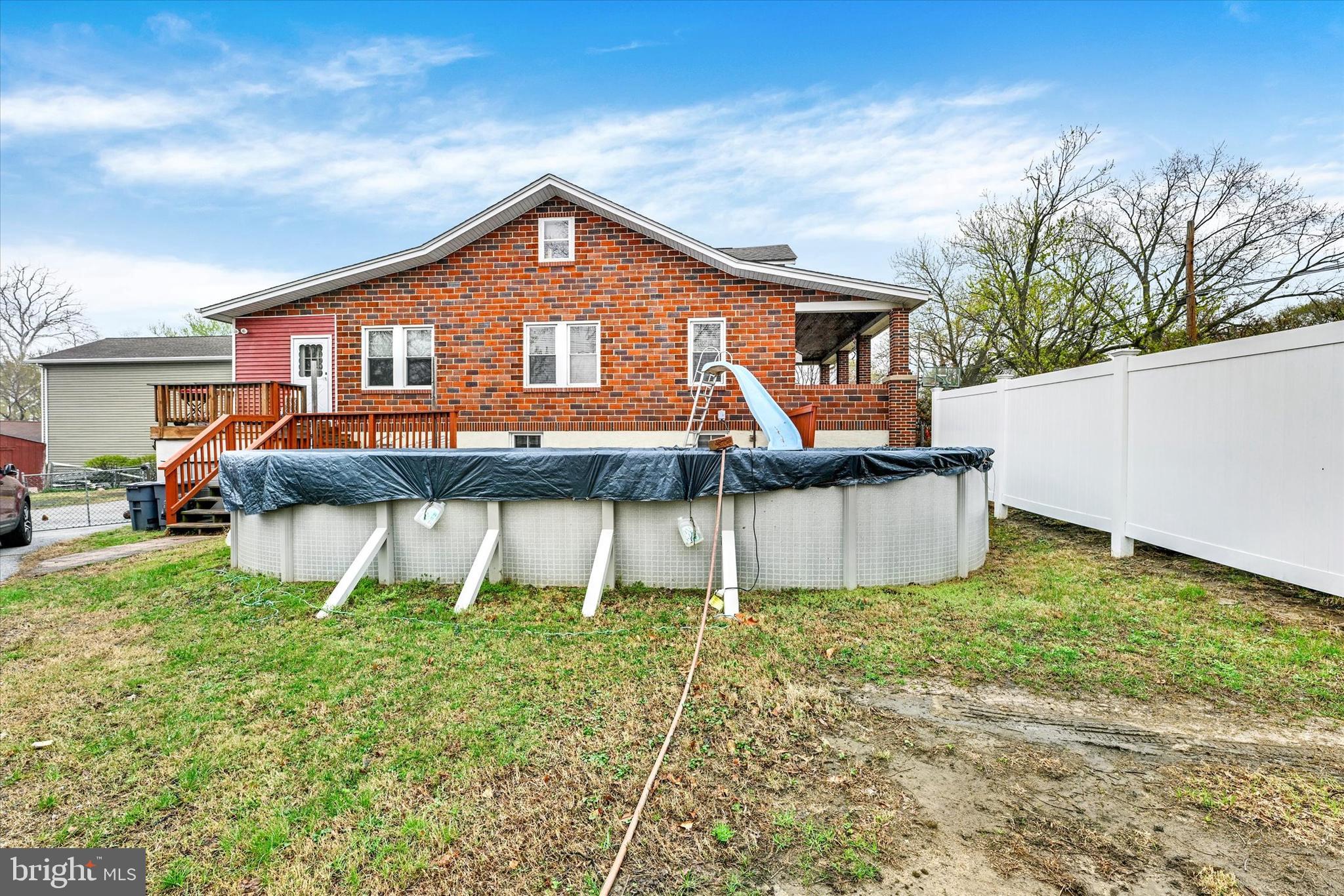 4630 Magnolia Avenue Baltimore, MD 21227 - Photo 29 of 31 a front view of house with yard and trees in the background