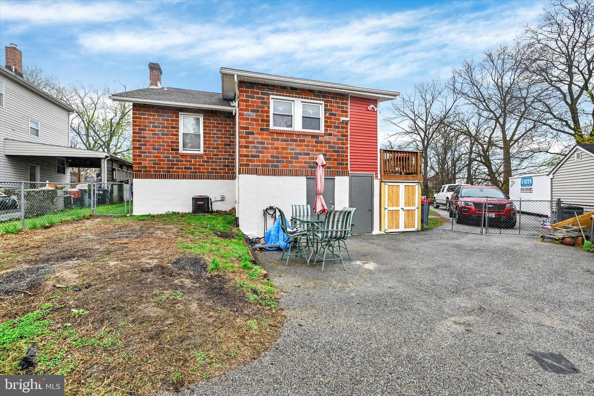 4630 Magnolia Avenue Baltimore, MD 21227 - Photo 31 of 31 a view of a house with a patio and a yard