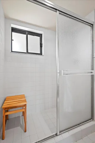 a bathroom with a shower and a toilet