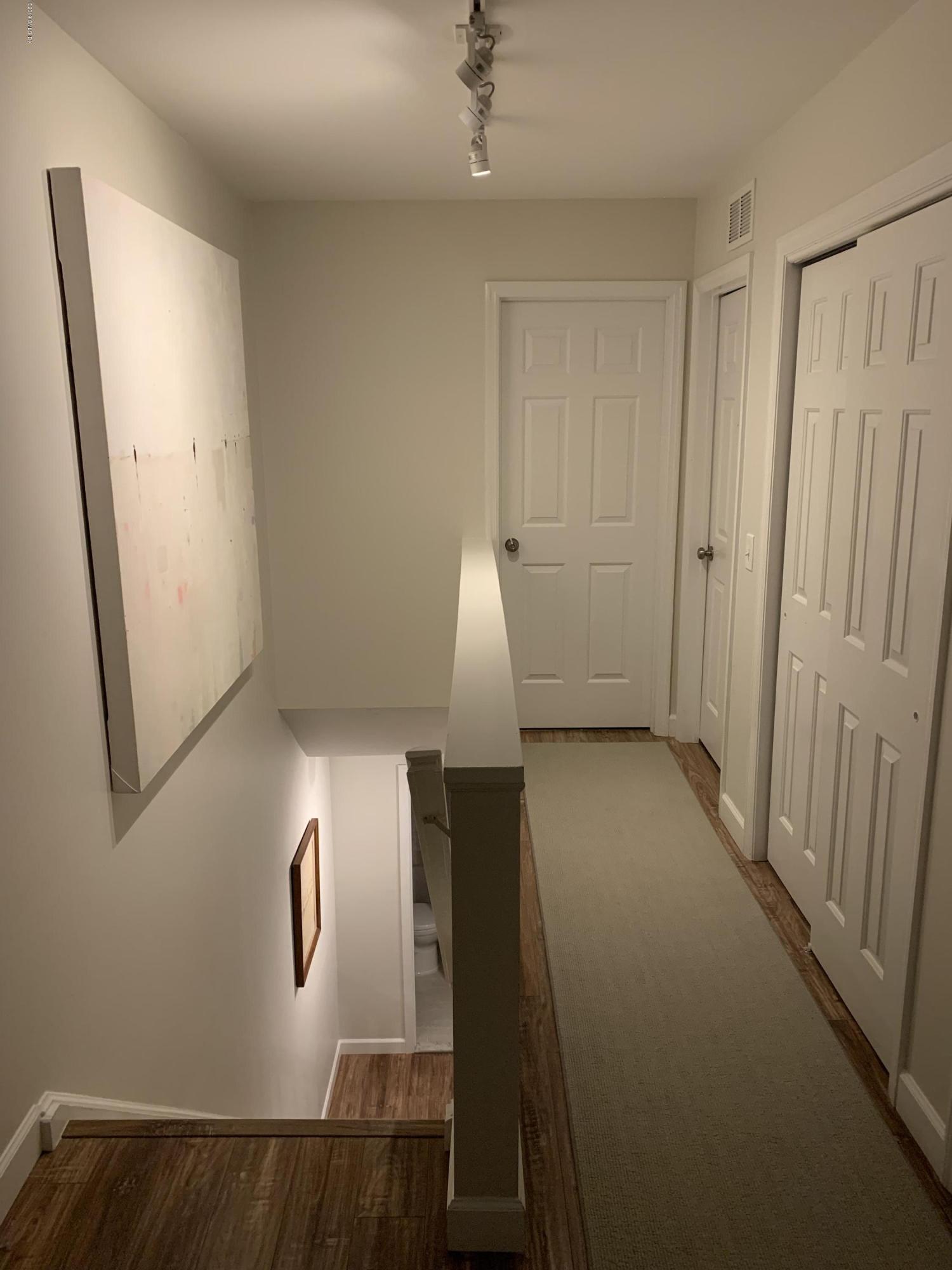 213 River Extension, Unit B Cos Cob, CT 06807 - Photo 13 of 15 a view of entryway with wooden floor