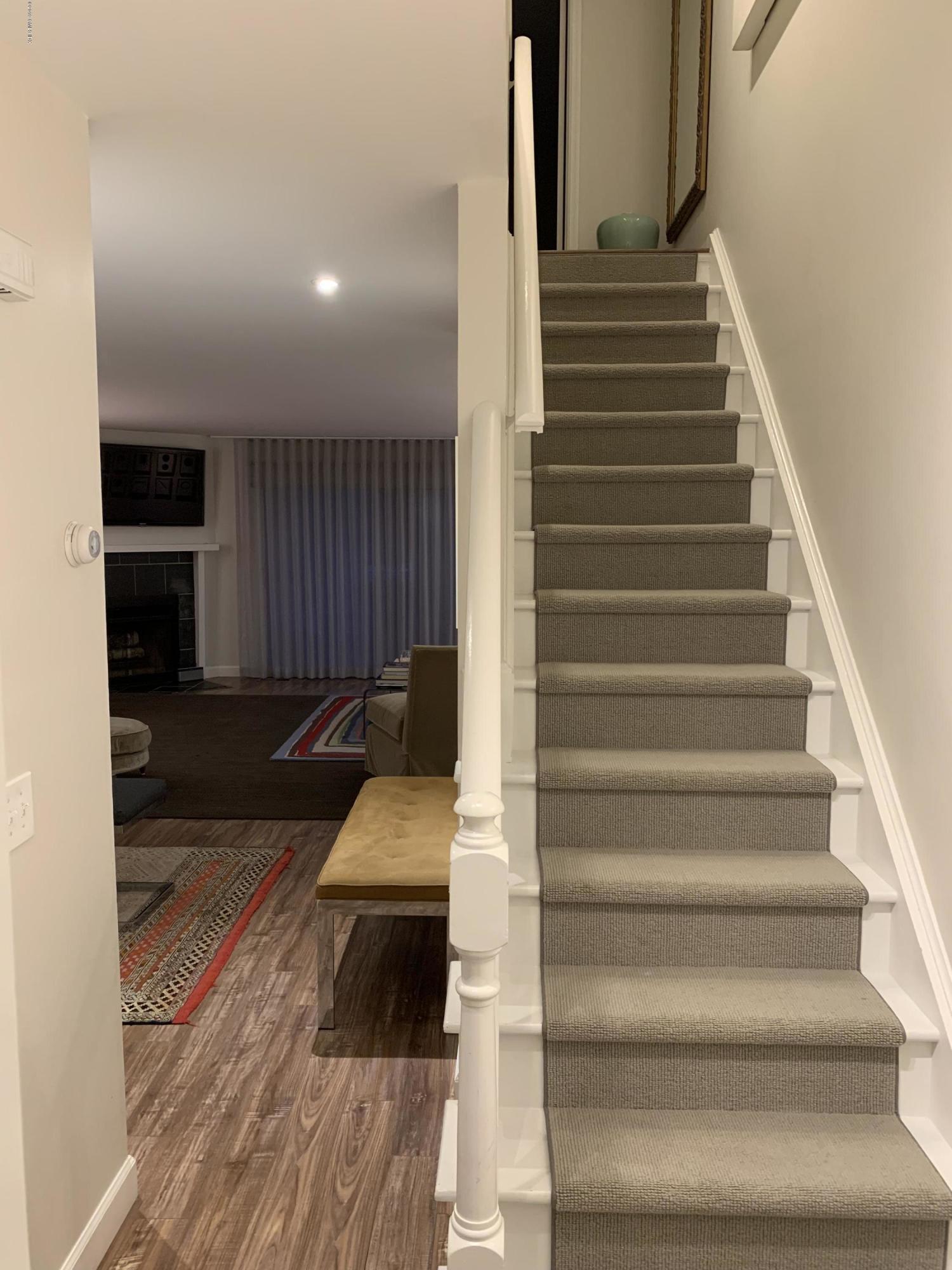 213 River Extension, Unit B Cos Cob, CT 06807 - Photo 10 of 15 a view of entryway and hall with wooden floor