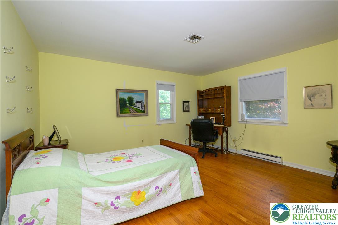2516 Rachael Lane Orefield, PA 18069 - Photo 19 of 45 Hardwood flooring extends through this naturally illuminated bedroom, creating a warm and inviting atmosphere.