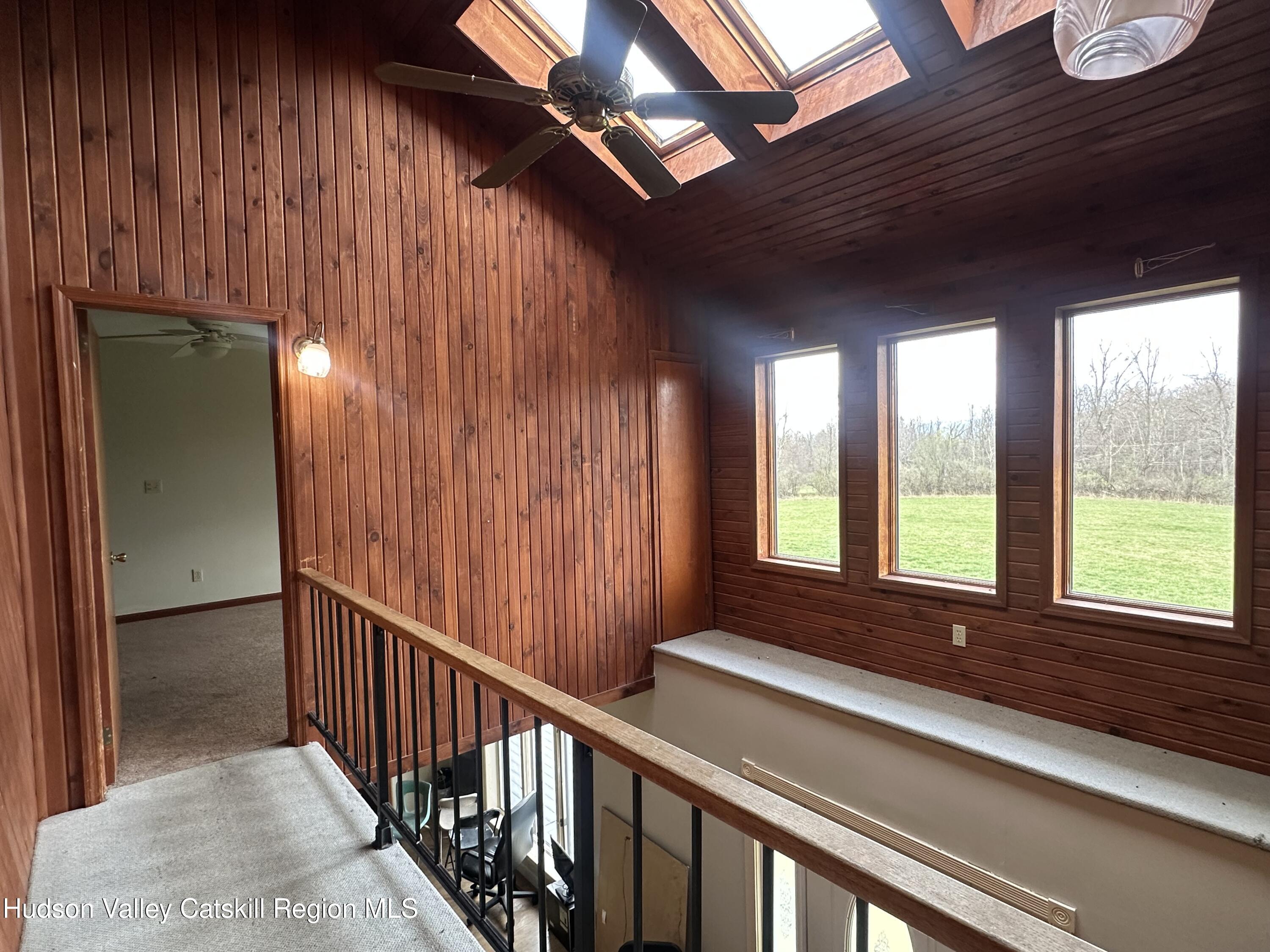 90 Ingalside Road Greenville, NY 12083 - Photo 18 of 36 a view of a room with large windows and furniture