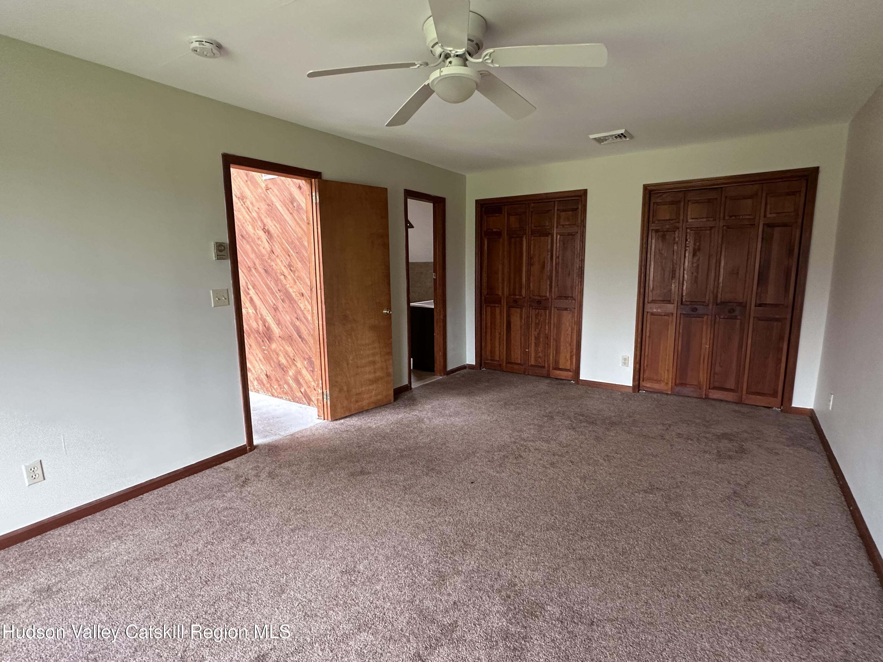 90 Ingalside Road Greenville, NY 12083 - Photo 20 of 36 an empty room with windows and fan