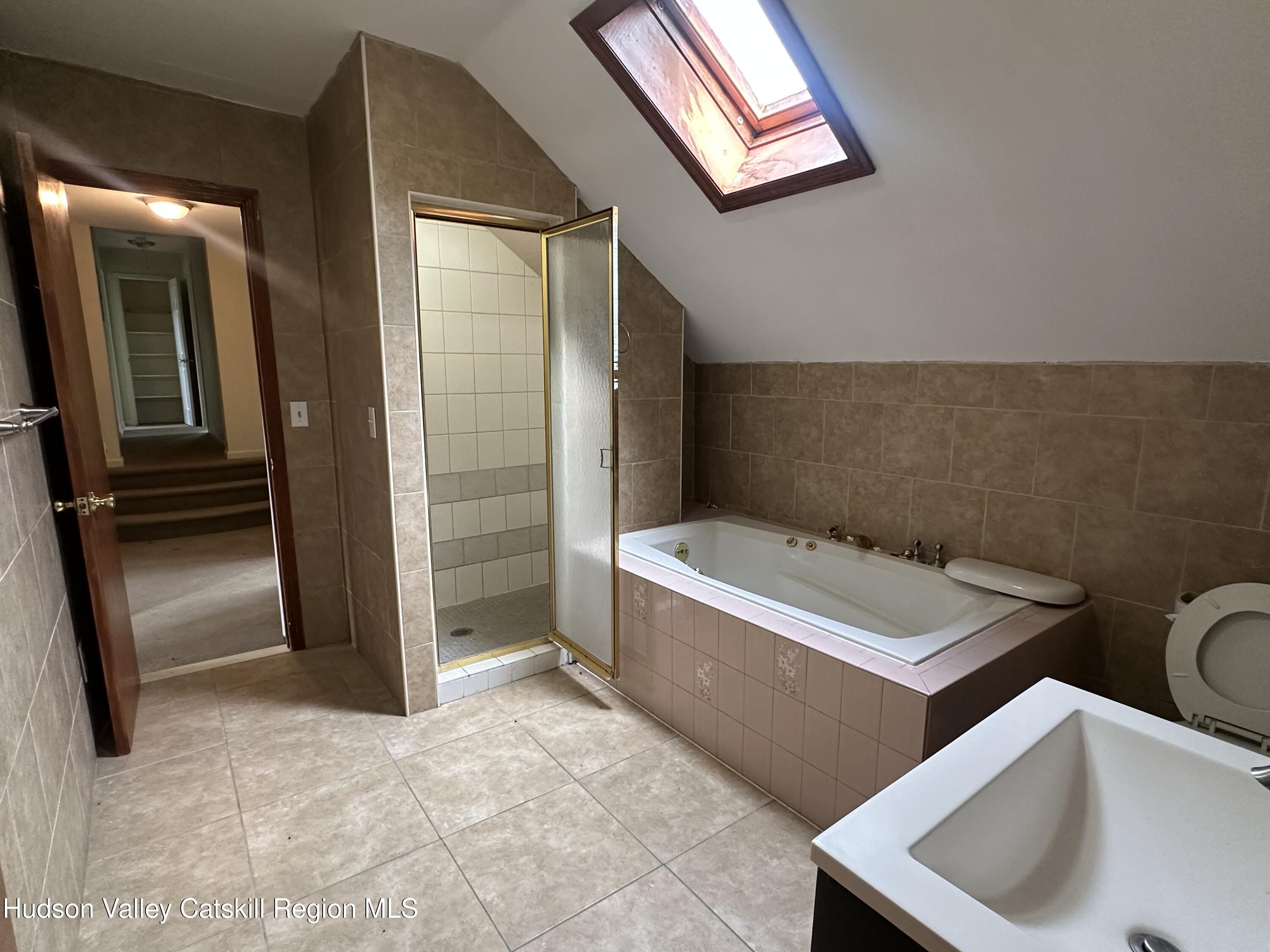 90 Ingalside Road Greenville, NY 12083 - Photo 21 of 36 a bathroom with a sink a toilet and shower