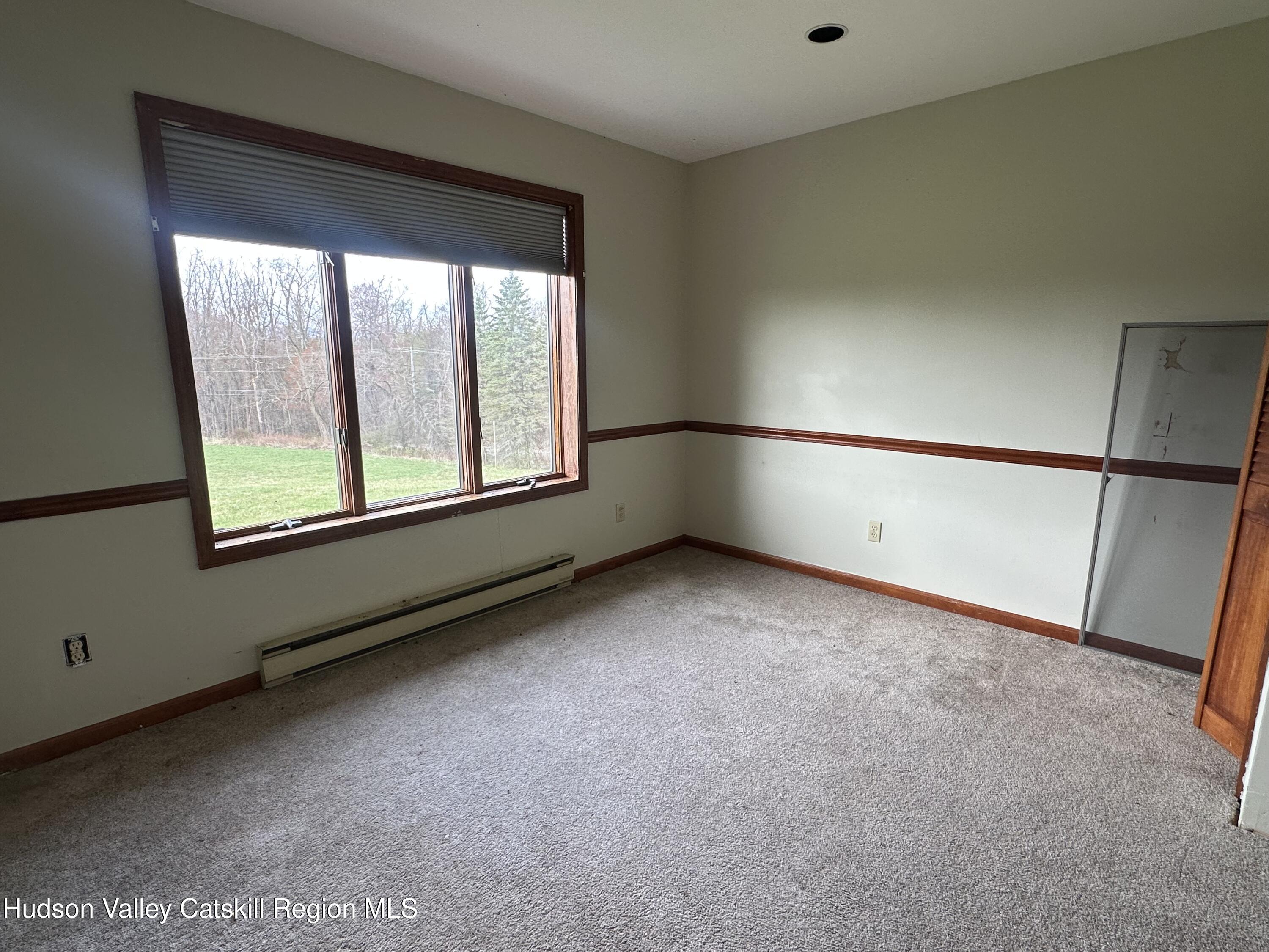 90 Ingalside Road Greenville, NY 12083 - Photo 27 of 36 a view of an empty room with a window