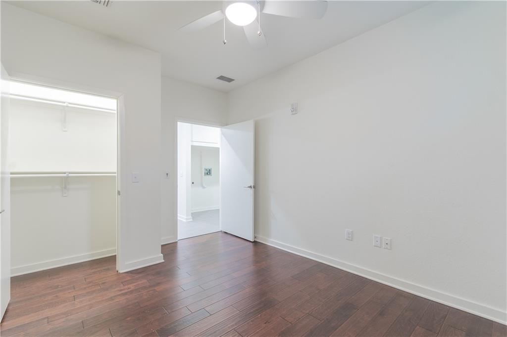 6700 Menchaca Road, Unit 12 Austin, TX 78745 - Photo 14 of 20 wooden floor in an empty room