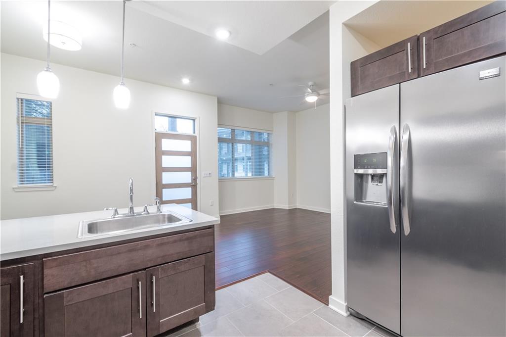 6700 Menchaca Road, Unit 12 Austin, TX 78745 - Photo 10 of 20 a bathroom with a double vanity sink and a mirror