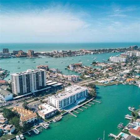 an aerial view of a house with a lake view