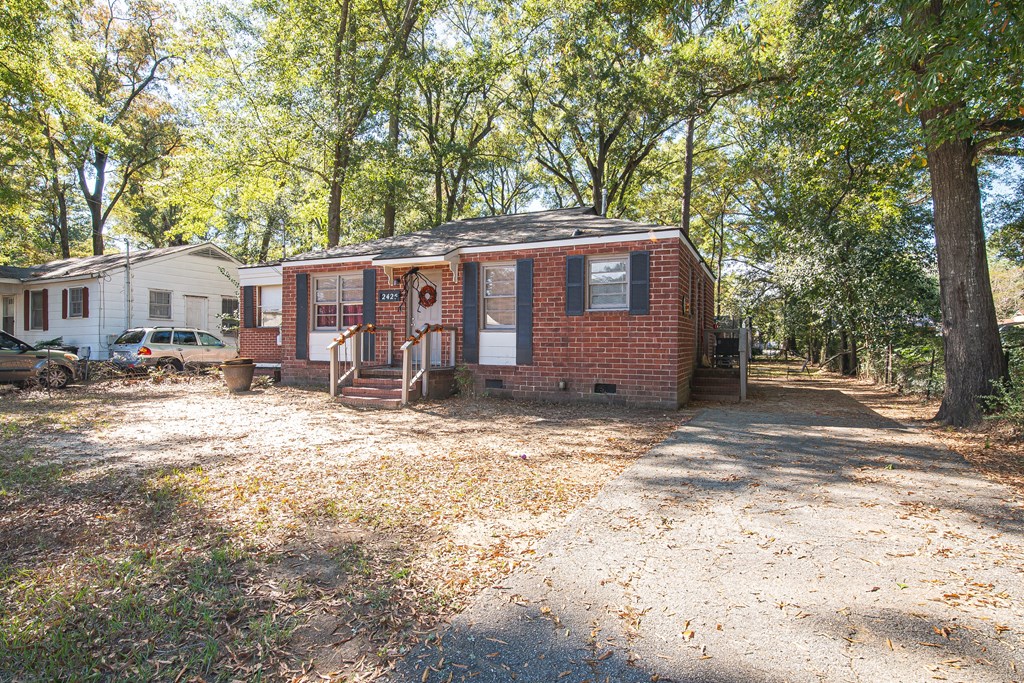 2425 Howe Avenue Columbus, GA 31903 - Photo 2 of 2 a view of a house with a yard covered in snow