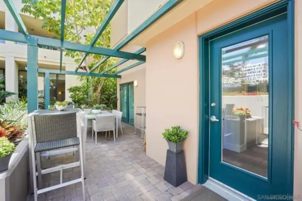 a view of an outdoor dining space with a porch