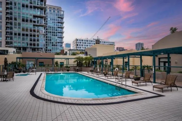 a view of a swimming pool with sitting area
