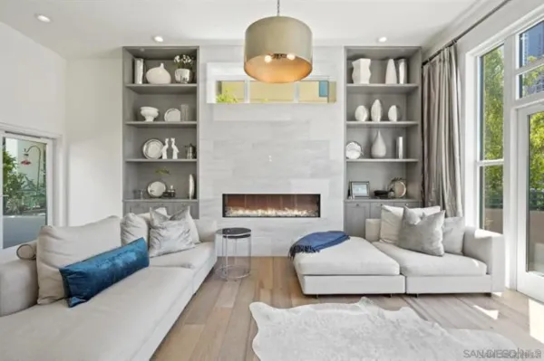 a living room with furniture and a fireplace
