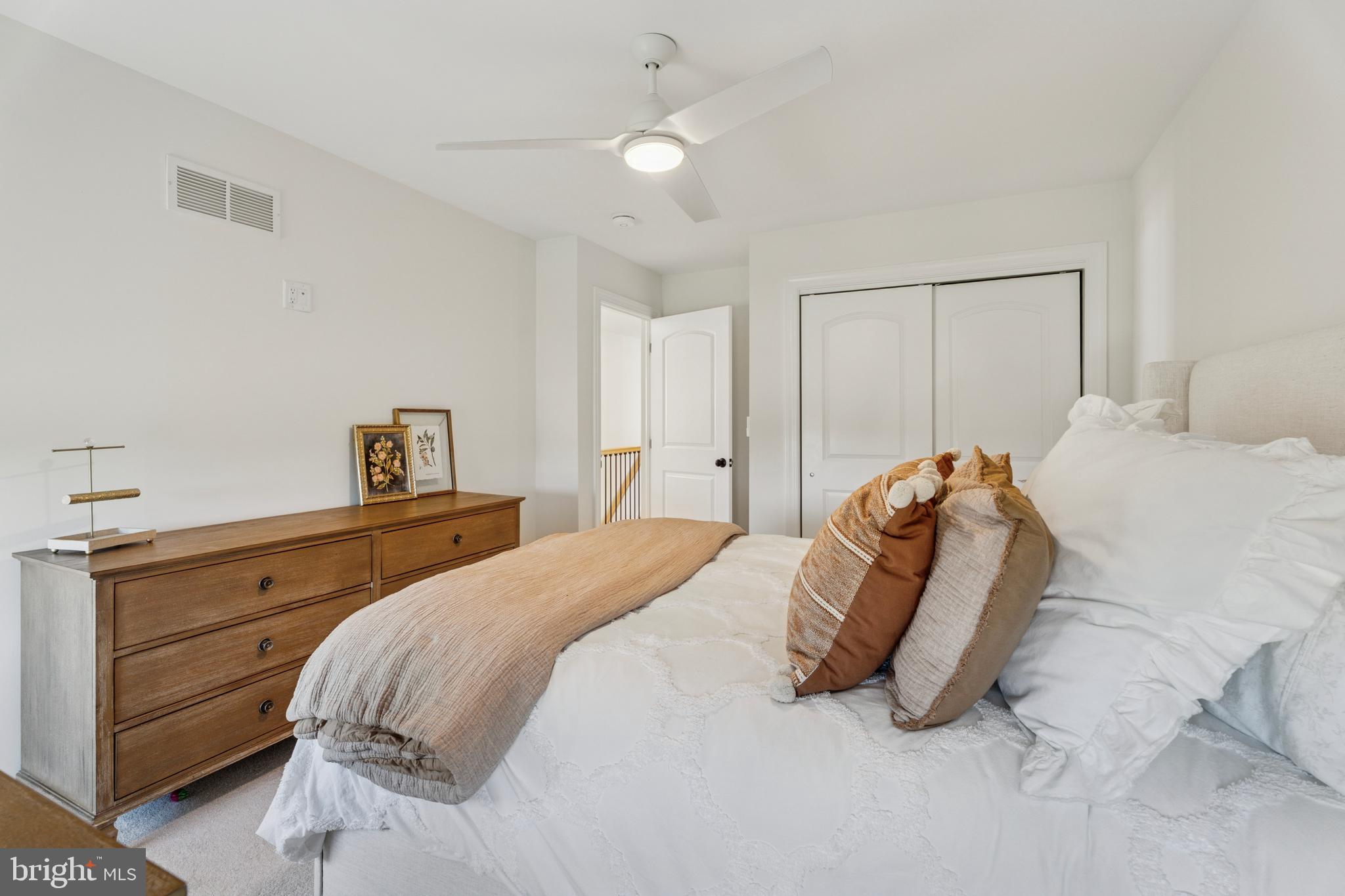 1603 Chestnut Ridge Road Upper Black Eddy, PA 18972 - Photo 35 of 41 a bedroom with a bed and a chandelier