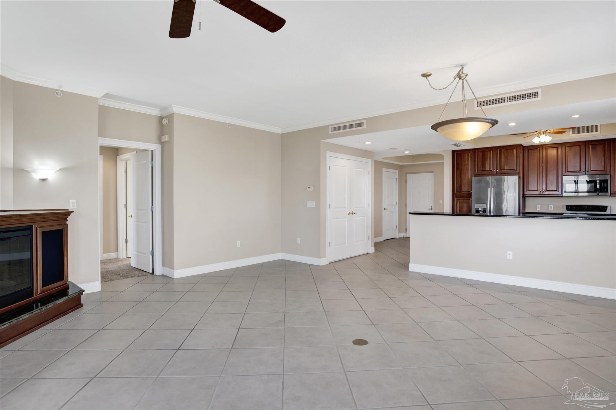 608 Lost Key Drive, Unit 701C Pensacola, FL 32507 - Photo 17 of 32 a view of a kitchen with a sink and a fireplace