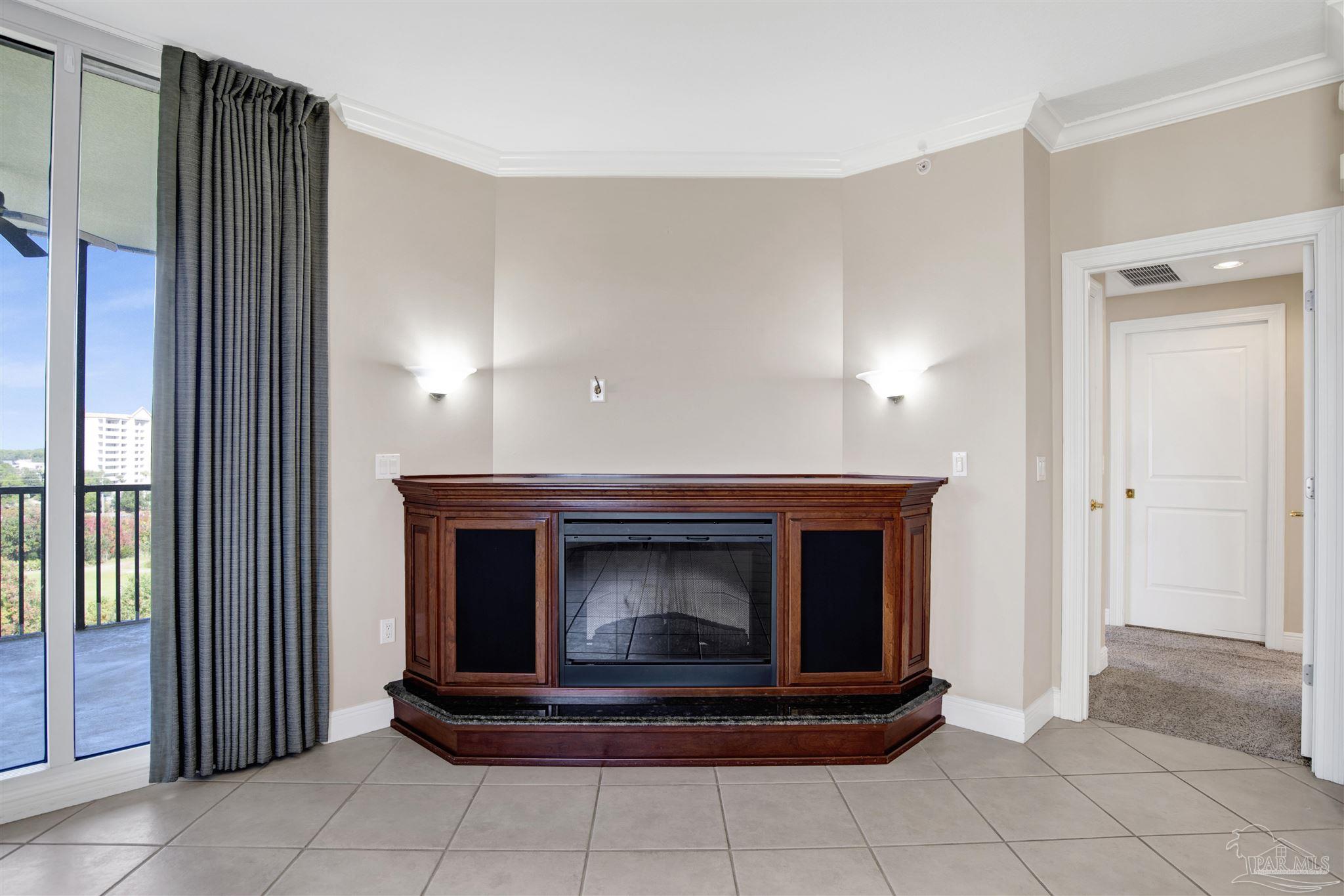 608 Lost Key Drive, Unit 701C Pensacola, FL 32507 - Photo 18 of 32 a living room with fireplace