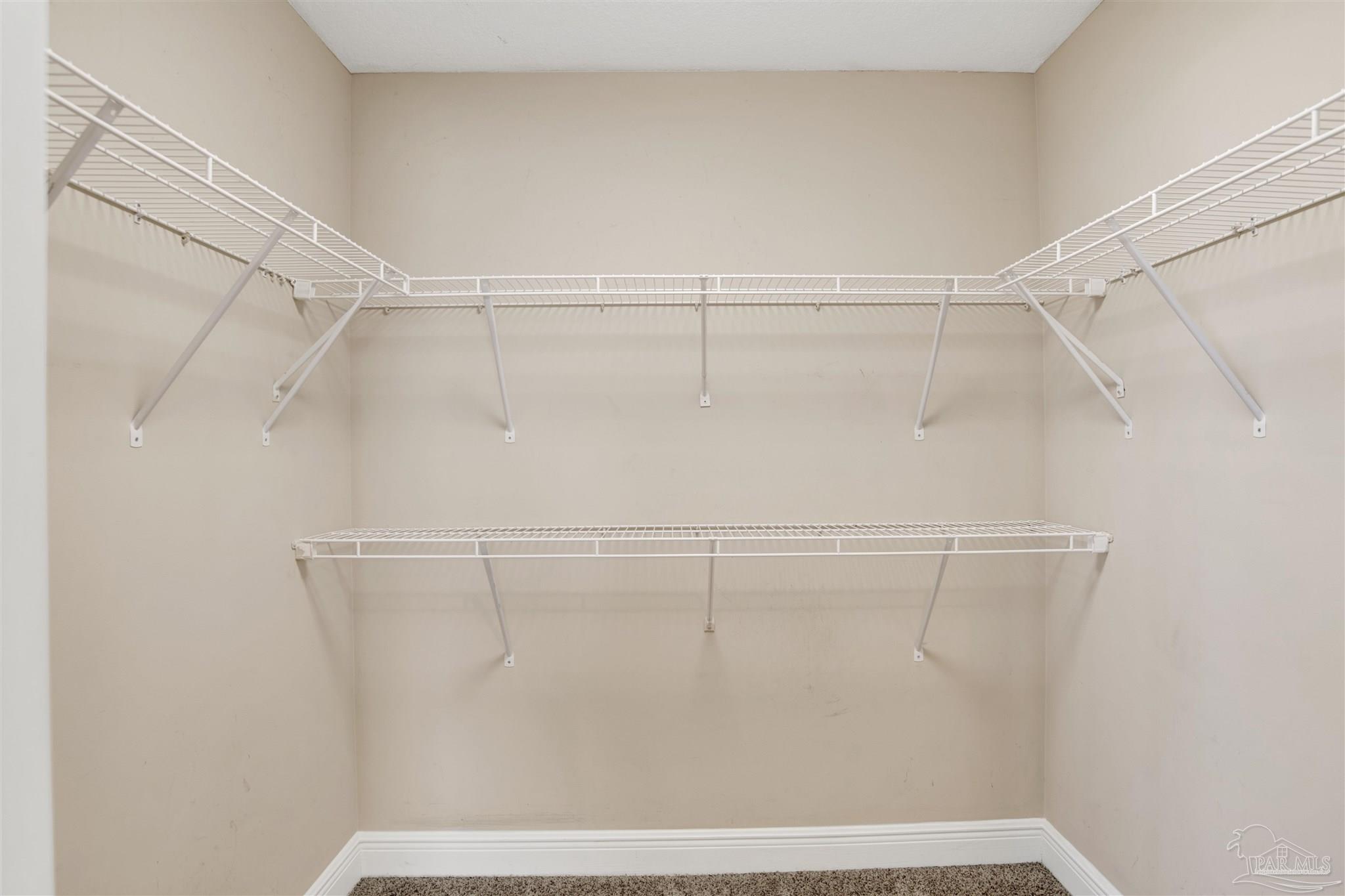 608 Lost Key Drive, Unit 701C Pensacola, FL 32507 - Photo 20 of 32 a view of a room with racks on the wall