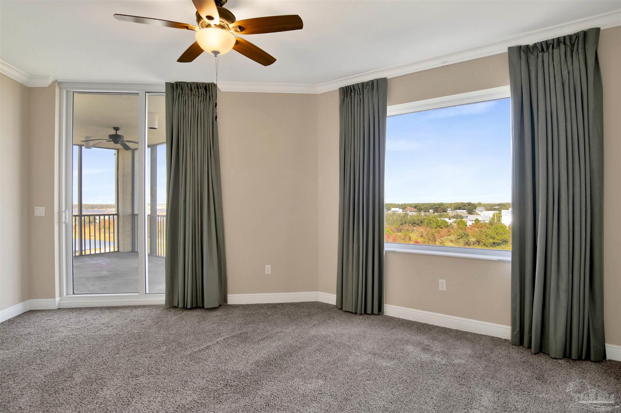 608 Lost Key Drive, Unit 701C Pensacola, FL 32507 - Photo 2 of 32 an empty room with windows and closet