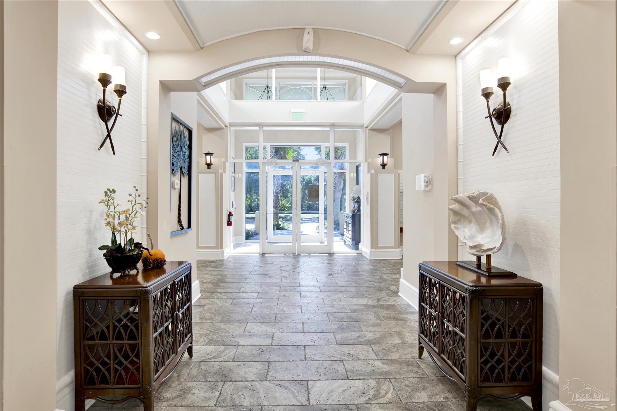 608 Lost Key Drive, Unit 701C Pensacola, FL 32507 - Photo 27 of 32 a living room with furniture and a large window