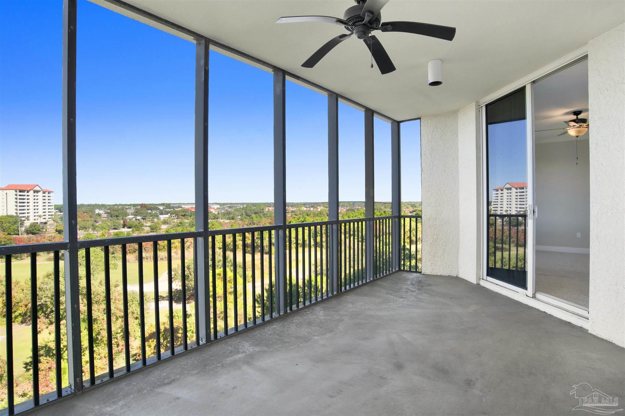608 Lost Key Drive, Unit 701C Pensacola, FL 32507 - Photo 31 of 32 a view of a porch with a floor to ceiling window