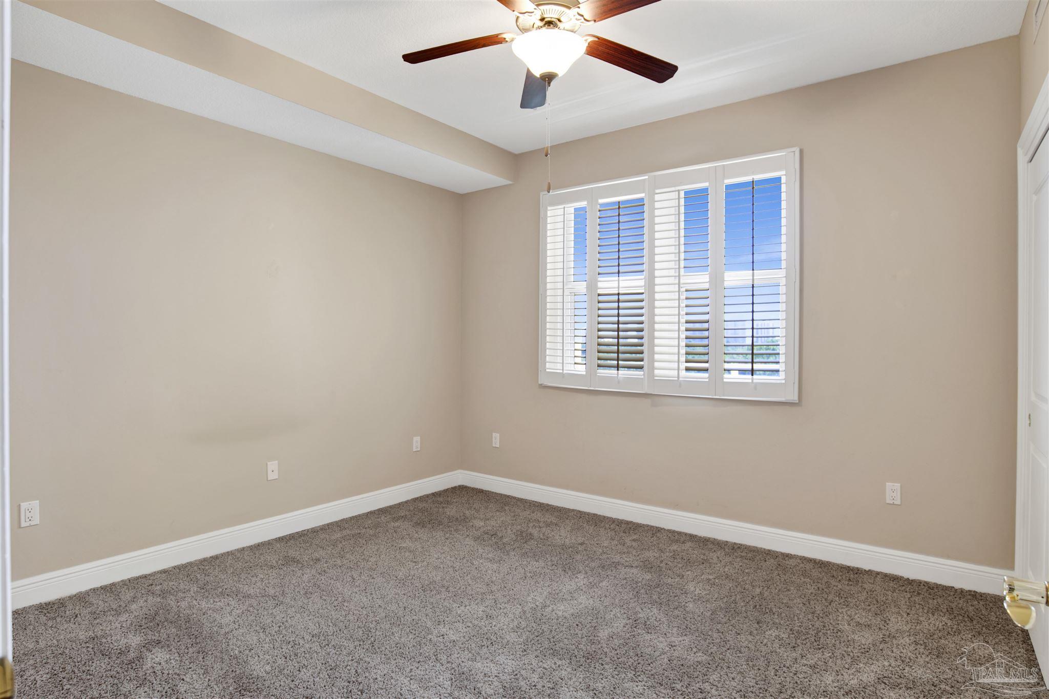 608 Lost Key Drive, Unit 701C Pensacola, FL 32507 - Photo 4 of 32 a view of an empty room with a window