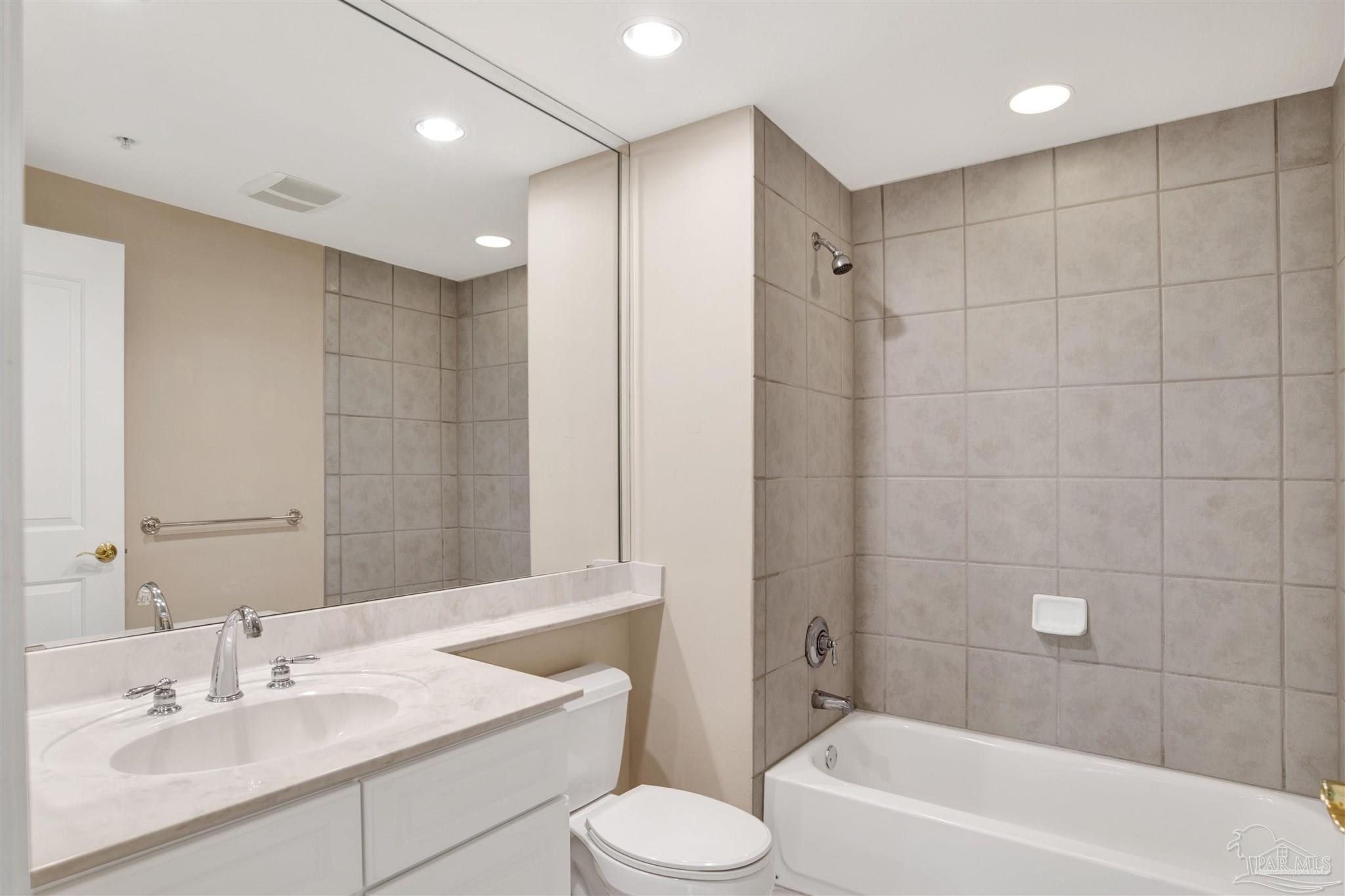 608 Lost Key Drive, Unit 701C Pensacola, FL 32507 - Photo 6 of 32 a bathroom with a sink toilet bathtub and vanity