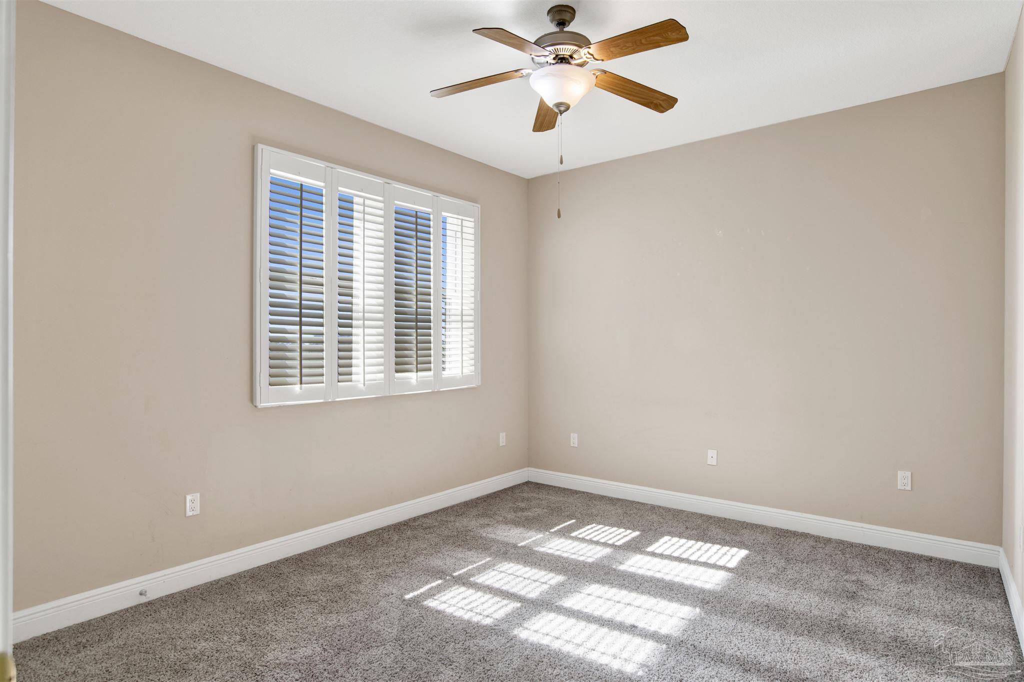 608 Lost Key Drive, Unit 701C Pensacola, FL 32507 - Photo 8 of 32 a view of an empty room with a window