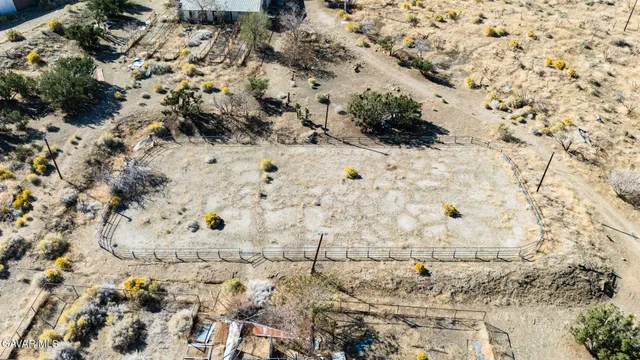 a view of a dry yard covered with snow
