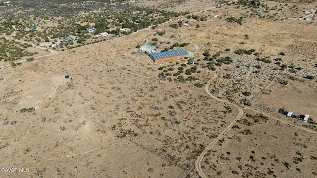 a bathroom with a blue wall and a shower