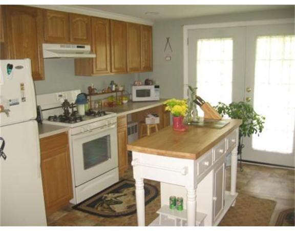 215 State Road Whately, MA 01373 - Photo 6 of 9 a kitchen with a sink stove and cabinets