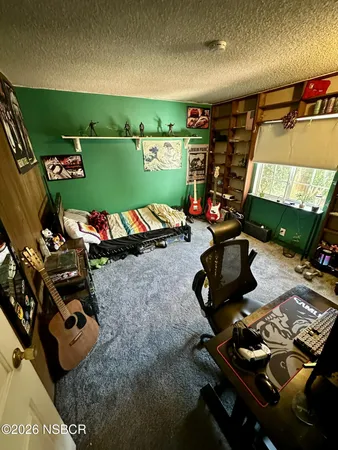 a room with furniture and a flat screen tv